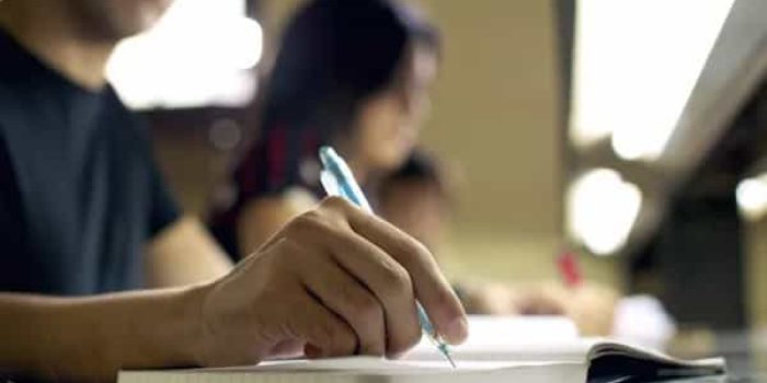 depositphotos_25399091-stock-photo-young-man-doing-homework-and (1)